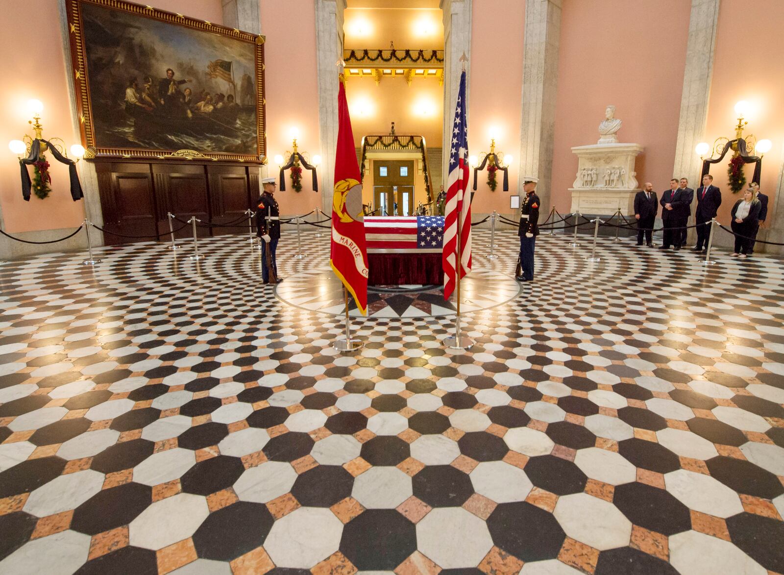 COLUMBUS, OHIO - DECEMBER 16: Former astronaut and U.S. Senator John Glenn lies in repose, under a United States Marine honor guard, in the Rotunda of the Ohio Statehouse December 16, 2016 in Columbus, Ohio. Glenn, who died at age 95, was the first American to orbit the Earth. He will be honored in a memorial service at Ohio State University's Mershon Auditorium. (Photo by Bill Ingalls/NASA via Getty Images)