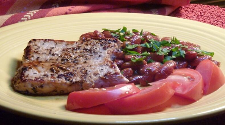 Cracked Pepper Pork with Honey Mustard Baked Beans. (Linda Gassenheimer/TNS)
