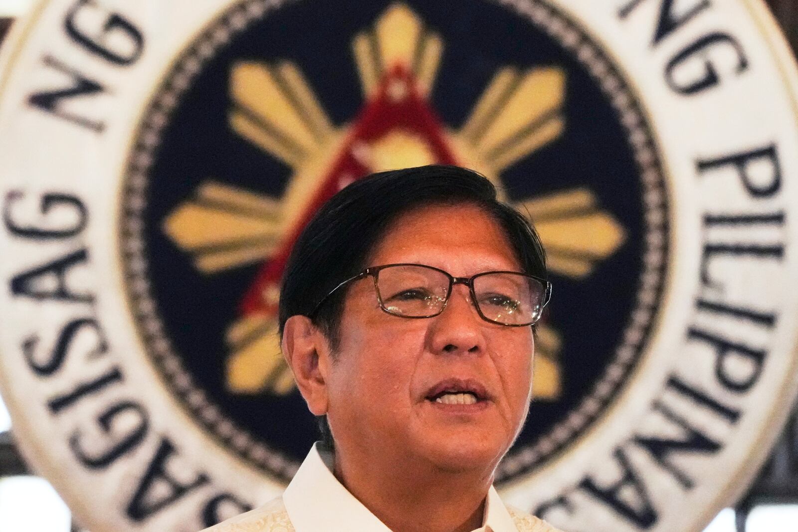 Philippine President Ferdinand Marcos Jr. speaks during the presentation of the newly enacted laws to stakeholders at the Malacanang Presidential Palace in Manila, Philippines Thursday, May 22, 2025. (AP Photo/Aaron Favila)