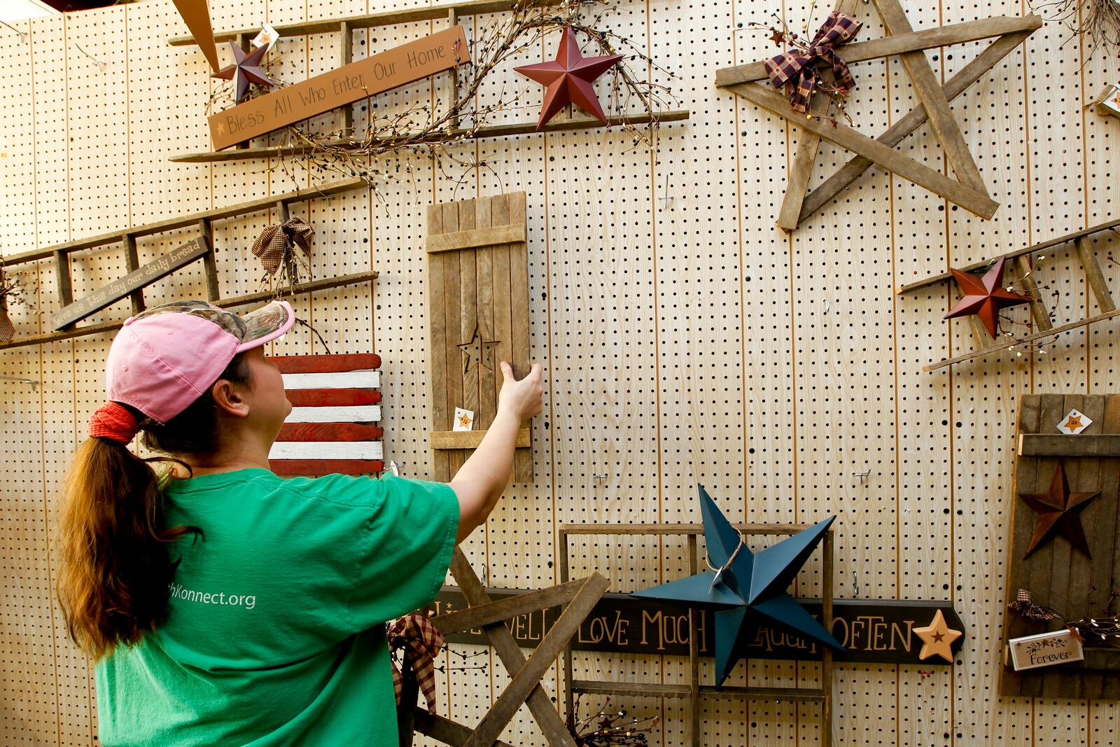 Nichole Back, of Franklin, removes hand-made items from her booth at Caesar Creek Markets Thursday, March 22, 2012, in Wilmington, Ohio. The marketplace suffered severe smoke damage from a fire on Friday, March 23, which has forced all indoor tenants to remove their items. Staff photo by Nick Daggy