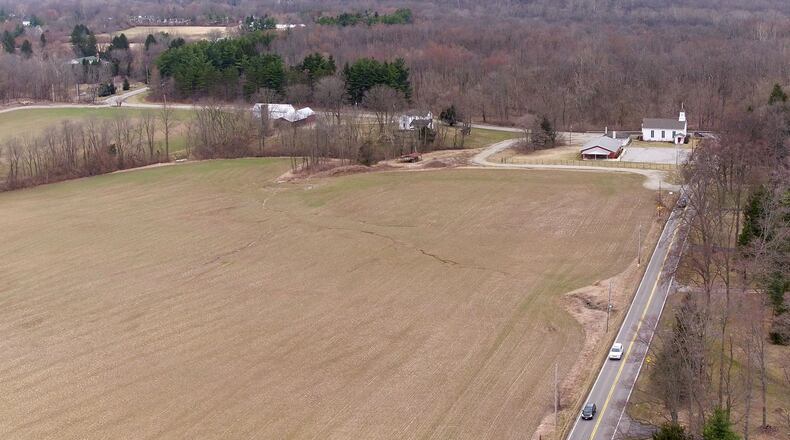 Aerial view looking north along Wilmington-Dayton Road and Conference Road in Sugarcreek Twp. Sugarcreek trustees may vote on whether to allow Oberer to build homes on 85 acres known as the Rammel property at this location. TY GREENLEES / STAFF