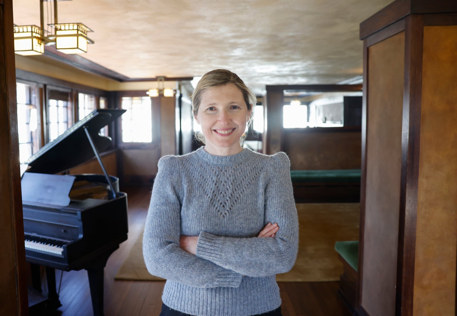 Executive director and curator Marta Wojcik in the main room of Frank Lloyd Wright's Westcott House on Thursday, April 17, 2025. JOSEPH COOKE/STAFF