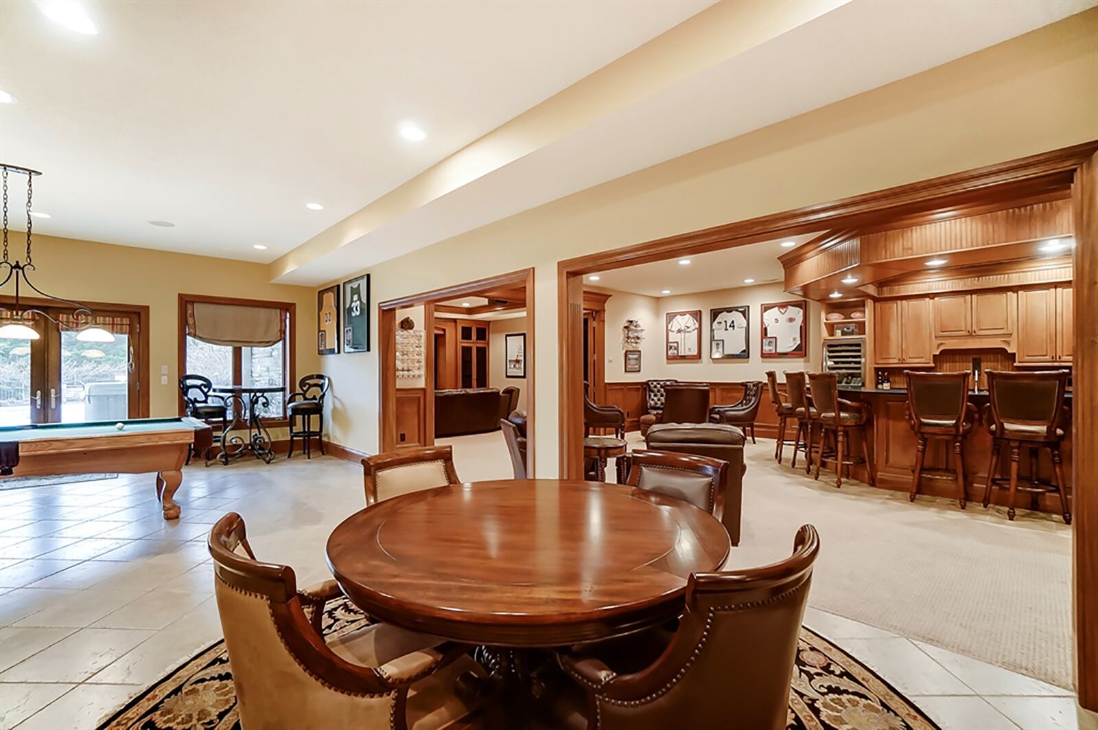 Nearly 2,400 square feet of living space within the walk-out lower level offers a Tuscan wine-tasting room, a sports tavern, cinema, full and half bathrooms and a flexible room that could be a fifth bedroom or family room. CONTRIBUTED PHOTO
