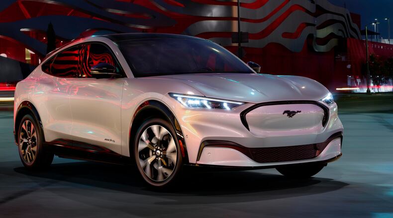 This undated photo provided by Ford shows the 2021 Ford Mustang Mach-E, which is the Edmunds Top Rated Luxury EV for 2021. It offers a premium cabin and an experience behind the wheel worthy of its Mustang namesake. (Courtesy of Ford Motor Co. via AP)