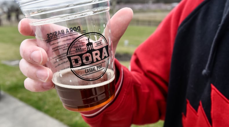 Designated outdoor refreshment area (DORA) districts have been a real boom for Butler County, and the state. NICK GRAHAM/FILE