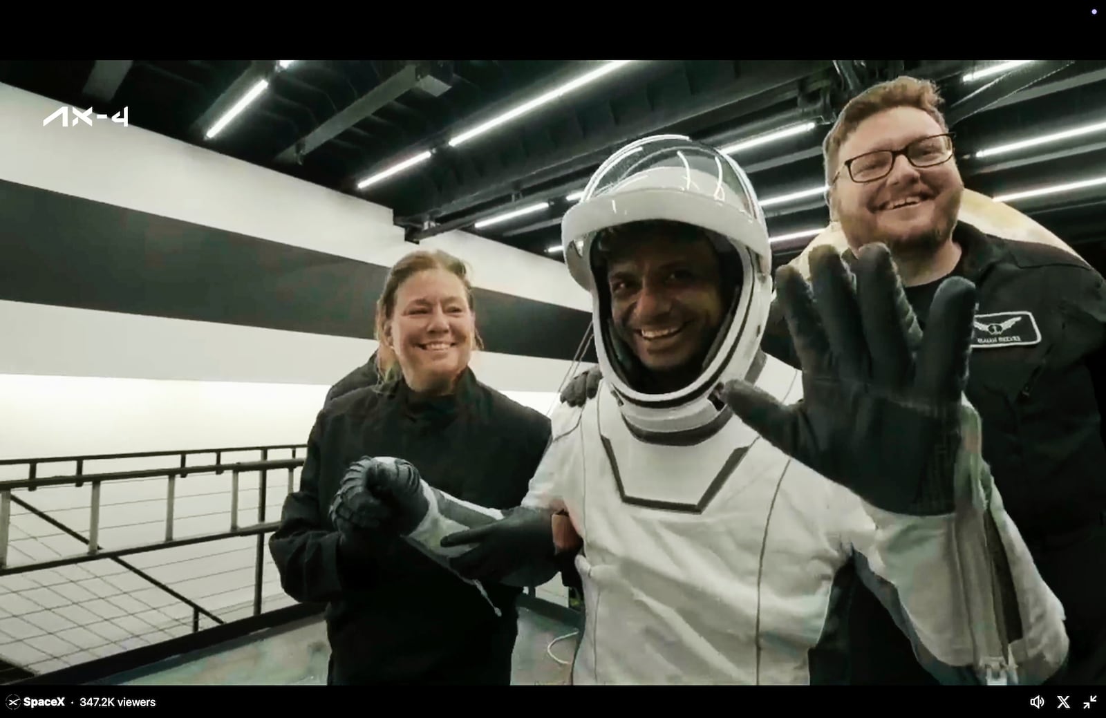 In this image made from video provided by SpaceX, one of the four astronauts, India's Shubhanshu Shukla, waves as he comes out of a SpaceX capsule loaded at the recovery ship after parachuting into the Pacific Ocean off the coast of Southern California on Tuesday, July 15, 2025. (SpaceX via AP)
