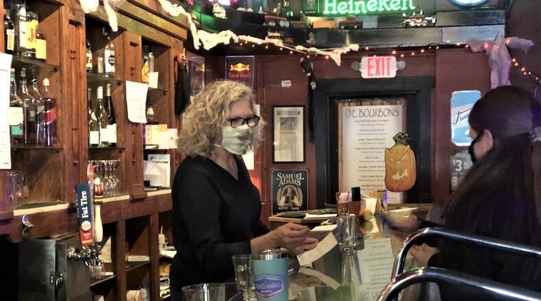 Susan Bavaro, co-owner of Oregon Express, serves customers on Friday afternoon. CORNELIUS FROLIK / STAFF