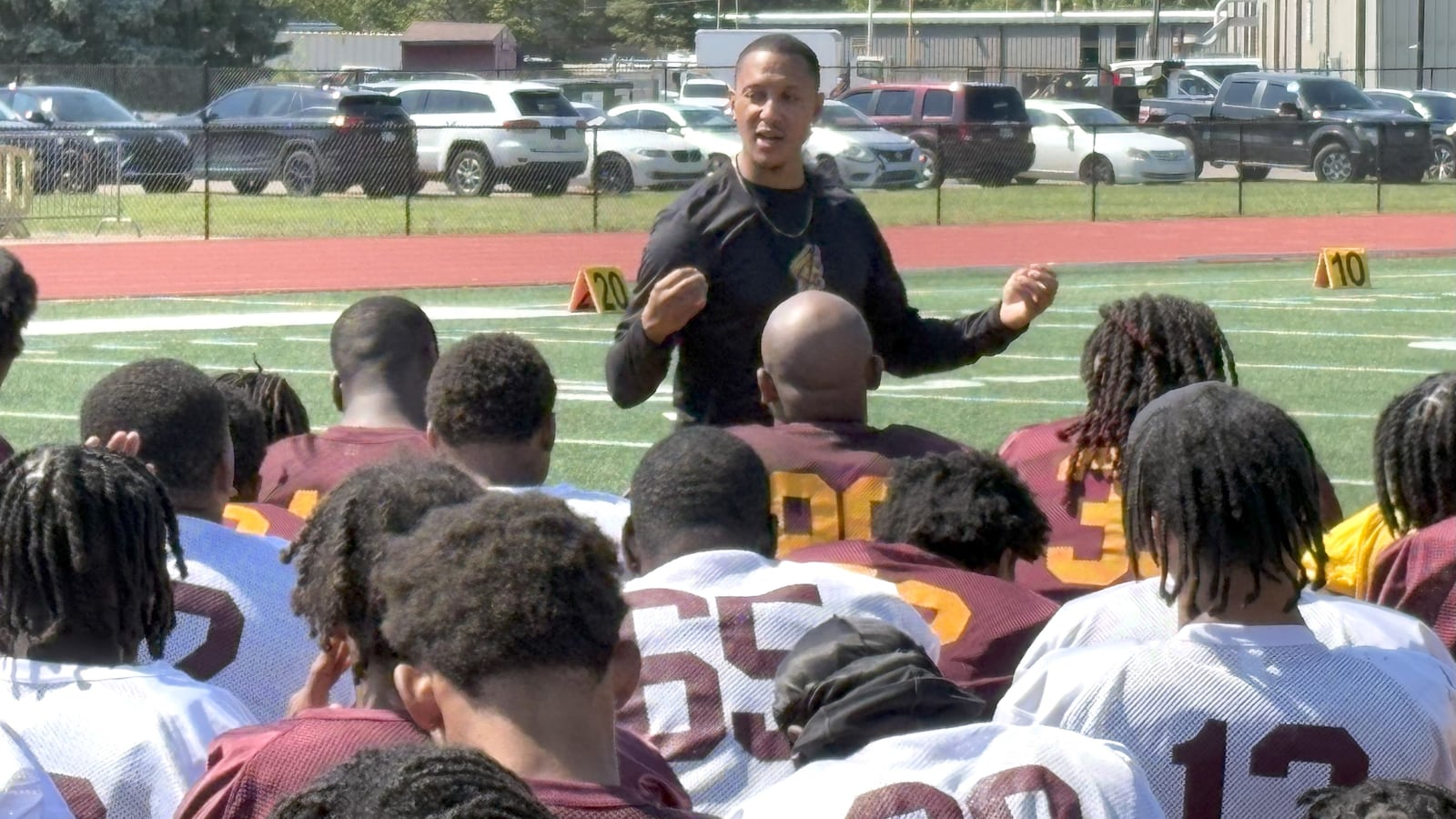 Tony Carter, the former NFL defensive back who is the new Central State head football  coach this season, addresses his team after the first day of practice Wednesday at McPherson Stadium. He and his staff, which includes four other coaches who played in the NFL, brought in 55 new players this season, over 30 of them from the transfer portal. Carter is determined to revitalize a program that won three NAIA national titles in the early 1990s, but shut down for eight years soon after and hasn't had a winning season since 1995. TOM ARCHDEACON / CONTRIBUTED PHOTO