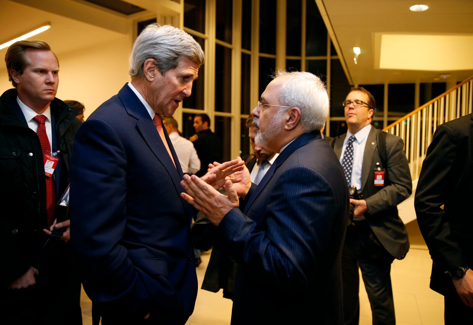 FILE - U.S. Secretary of State John Kerry, left, talks with Iranian Foreign Minister Mohammad Javad Zarif after the International Atomic Energy Agency (IAEA) verified that Iran has met all conditions under the nuclear deal, in Vienna, Jan. 16, 2016. (Kevin Lamarque/Pool via AP, File)