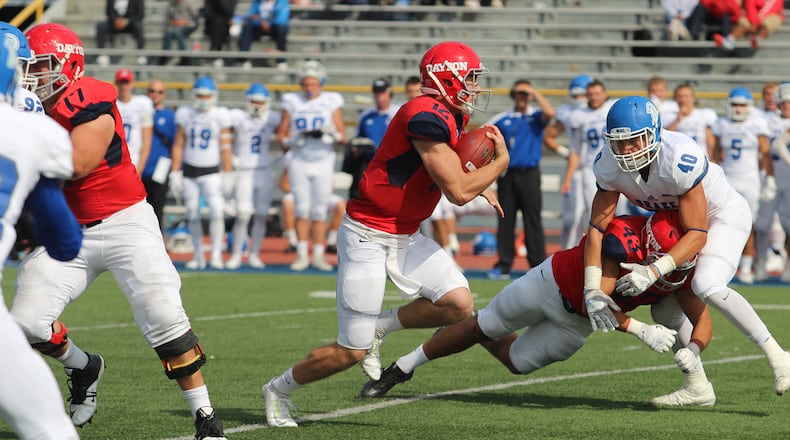 Alex Jeske finds a hole in the Drake defense during a game last season at Welcome Stadium. MIKE HARTSOCK/Staff
