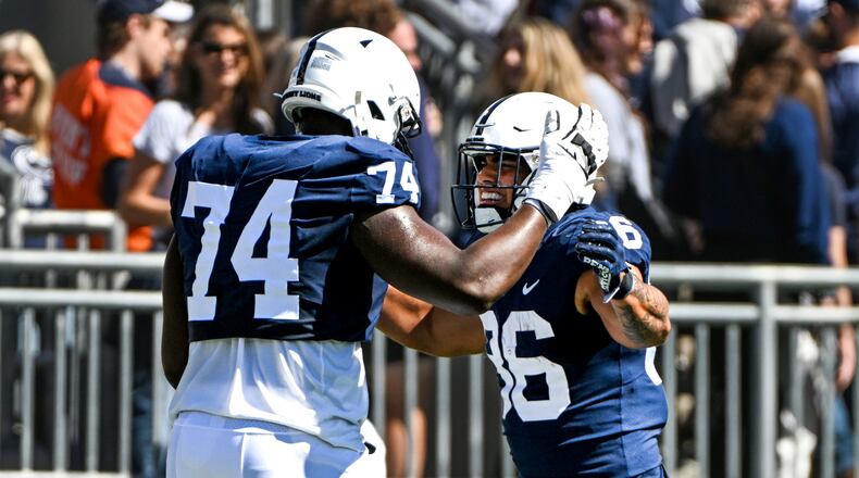 Penn State tight end Brenton Strange (86) celebrates with offensive lineman Olumuyiwa Fashanu (74) after scoring a touchdown during the first half of an NCAA college football game, Saturday, Sept. 24, 2022, in State College, Pa. (AP Photo/Barry Reeger)