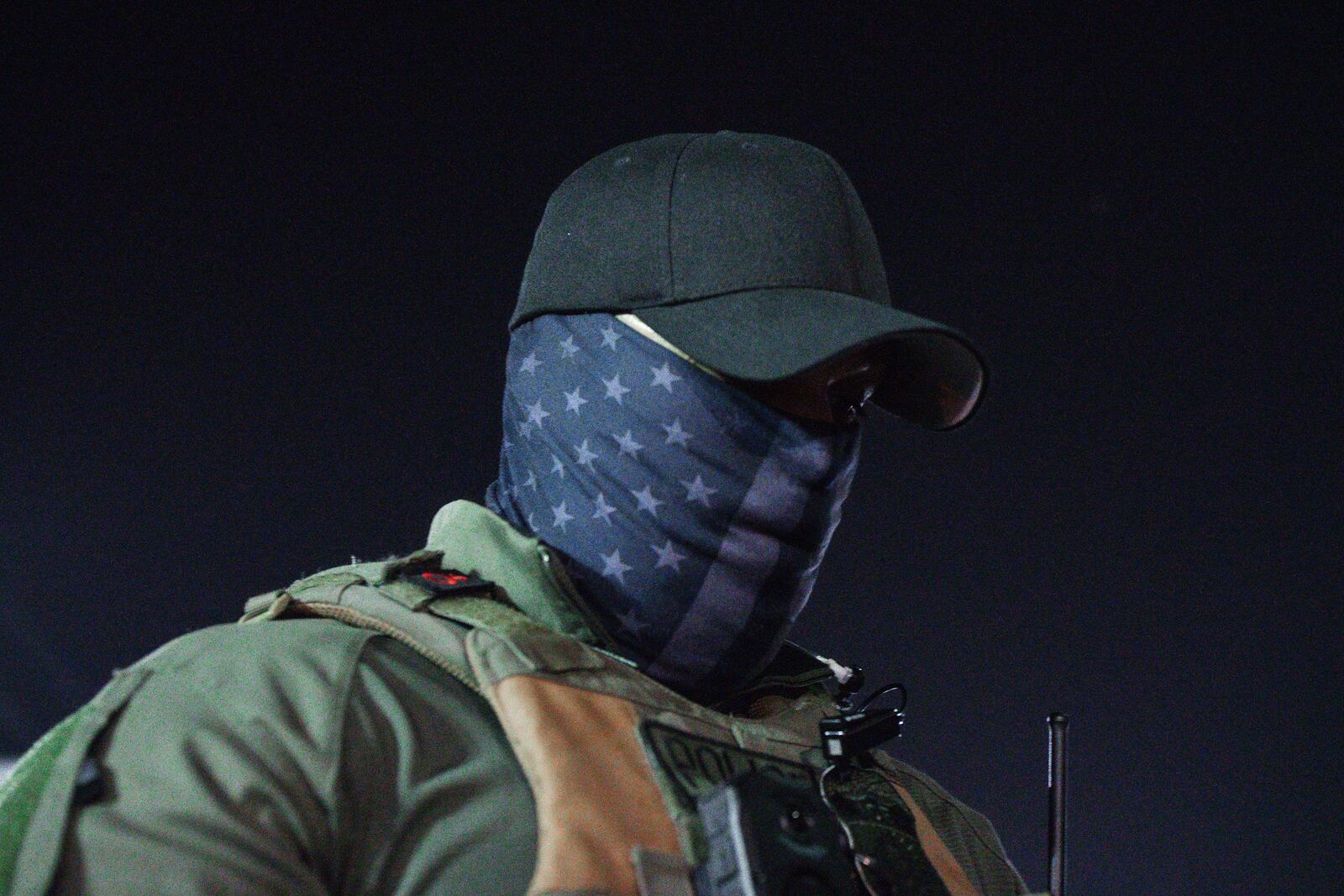 An Immigration and Customs Enforcement agent stands outside the Delaney Hall Detention Facility during protests over federal immigration enforcement raids on Thursday, June 12, 2025, in Newark, N.J. (AP Photo/Olga Fedorova)