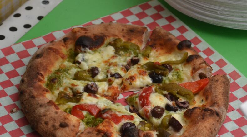 A just-baked pizza from Bella Sorella Pizza's wood-fired brick oven. Staff photo by Mark Fisher
