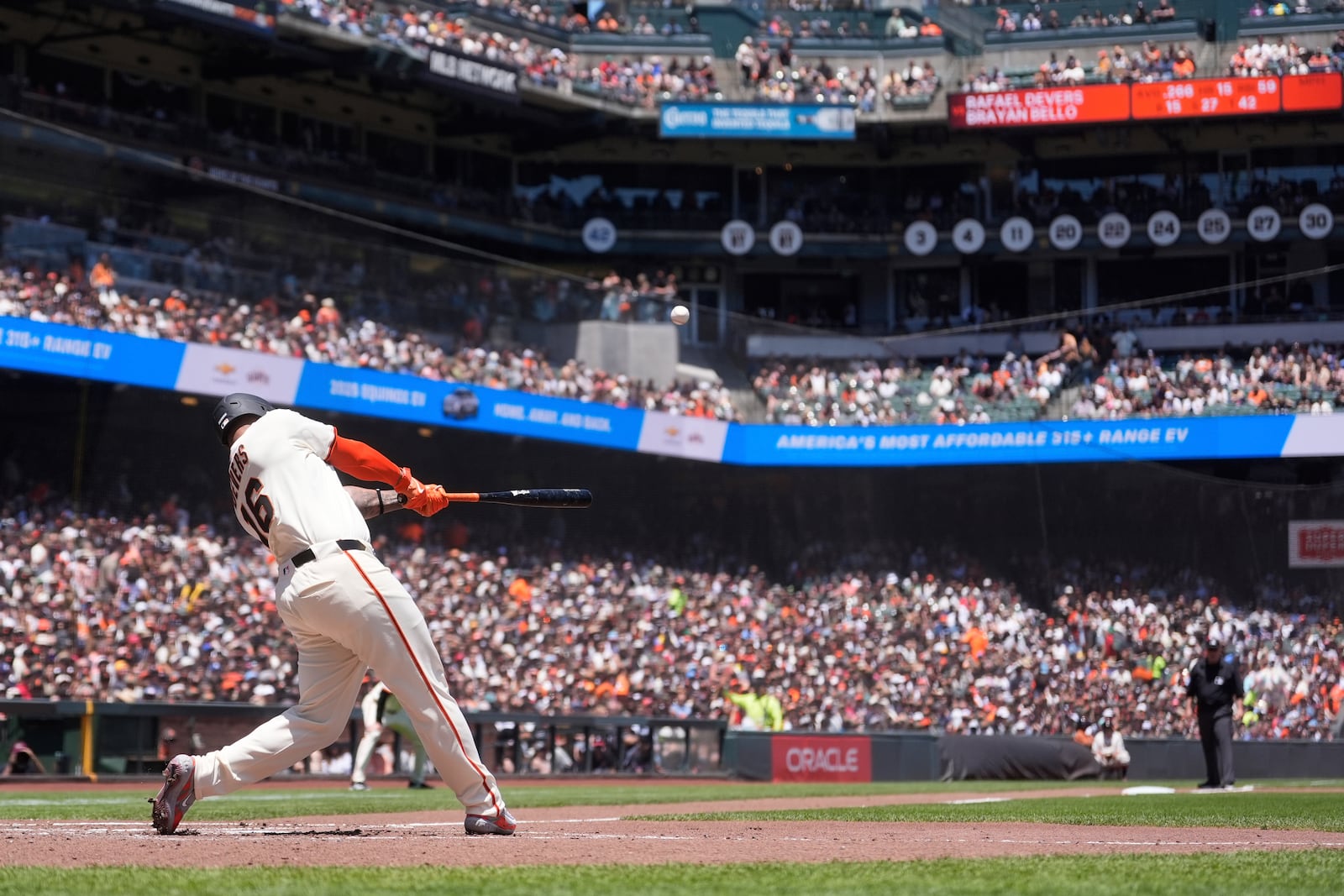 San Francisco Giants' Rafael Devers hits a two-run home run against the Boston Red Sox during the third inning of a baseball game in San Francisco, Saturday, June 21, 2025. (AP Photo/Jeff Chiu)