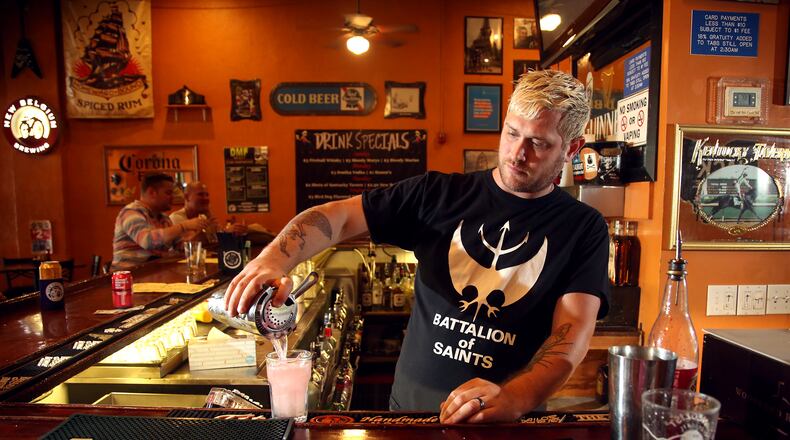 Josh Goldman has been the bartender at Blind Bob's in Dayton's Oregon District for 10 years. LISA POWELL / STAFF