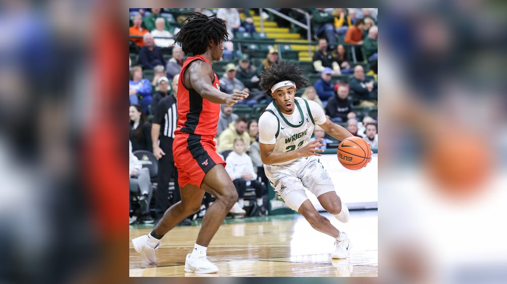 Wright State sophomore guard TJ Burch dribbles with pressure from Youngstown State's Jaiden Haynes during a Horizon League game against Youngstown State on Thursday, Jan. 15, 2026 at Ervin J. Nutter Center in Fairborn. BRYANT BILLING/STAFF