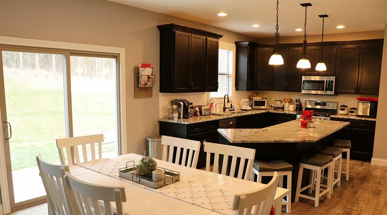The breakfast area connects to the patio through sliding glass doors.