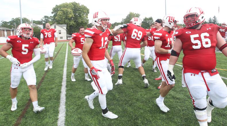 Wittenberg players celebrate a victory against Wabash on Sept. 24, 2016, at Edwards-Maurer Field in Springfield. David Jablonski/Staff