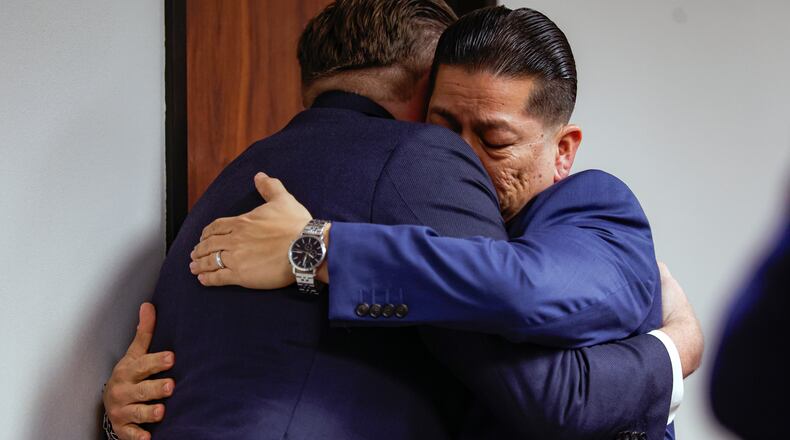 Former Uvalde school district police officer Adrian Gonzales, right, embraces his attorney Jason Goss after the jury found Gonzales not guilty at the Nueces County Courthouse on Wednesday, Jan. 21, 2026, in Corpus Christi, Texas. (Sam Owens/The San Antonio Express-News via AP, Pool)