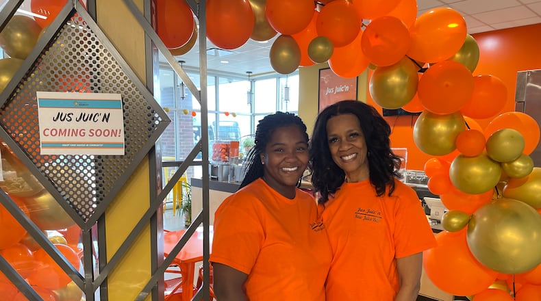 Jus Juic’n is holding a grand opening for its third location in the Dayton region inside Gem City Market at noon on Saturday, April 13. Pictured is General Manager T’Aira Scott and her mom, Shari Mann, the president of Jus Juic’n. NATALIE JONES/STAFF