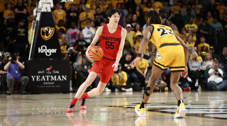 Dayton's Mike Sharavjamts dribbles against Virginia Commonwealth on Tuesday, Feb. 7, 2023, at the Siegel Center in Richmond, Va. David Jablonski/Staff