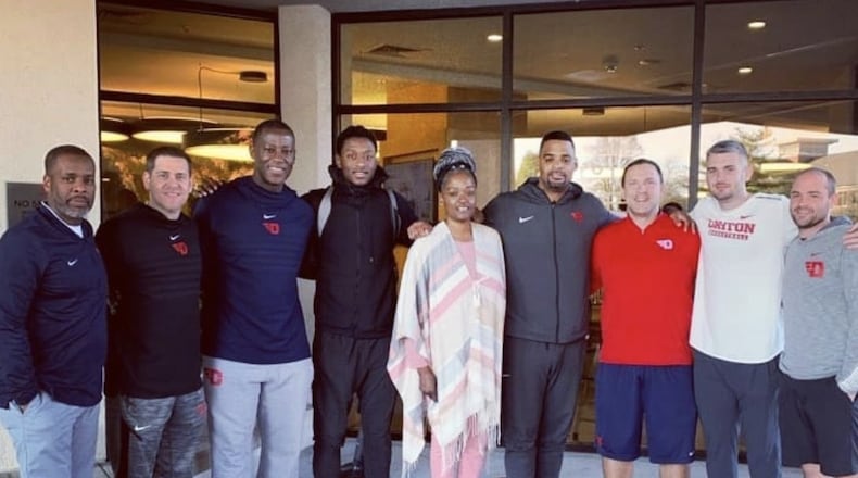 R.J. Blakney and his mom, Dafne’, pose with the Dayton coaching staff during their visit to campus. Submitted photo
