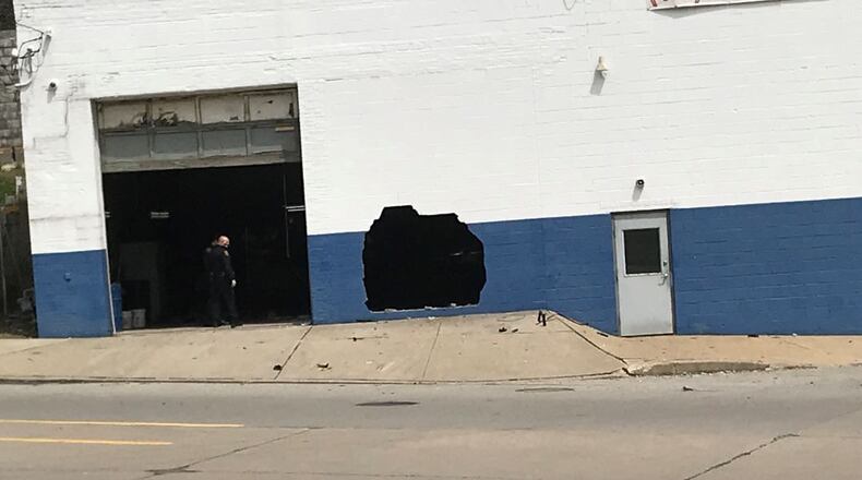 Police: Man crashes vehicle into Pittsburgh auto body shop, jumps 30 feet off nearby bridge