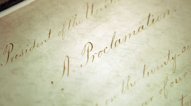 FILE - The original Emancipation Proclamation is shown on display in the Rotunda of the National Archives in Washington, Feb. 18, 2005. The tradition of Watch Night services in the United States dates back to Dec. 31, 1862, when many Black Americans gathered in churches and other venues, waiting for President Abraham Lincoln to sign the Emancipation Proclamation into law. It's still being observed each New Year's Eve, at many multiracial and predominantly Black churches across the country. (AP Photo/Evan Vucci, File)