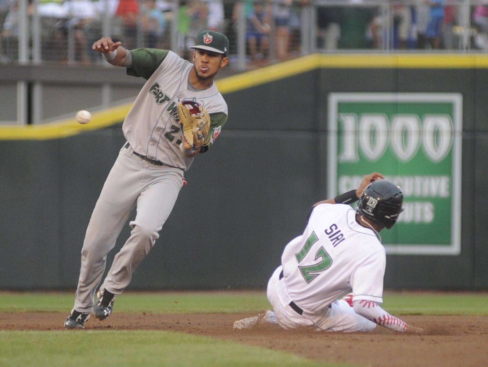 Jose Siri of the Dragons beats a throw to shortstop Fernando Tatis Jr. to steal second base. The Dragons defeated the Fort Wayne TinCaps (Padres) 4-2 in a Class A minor-league baseball at Dayton s Fifth Third Field on Monday, July 3, 2017. MARC PENDLETON / STAFF