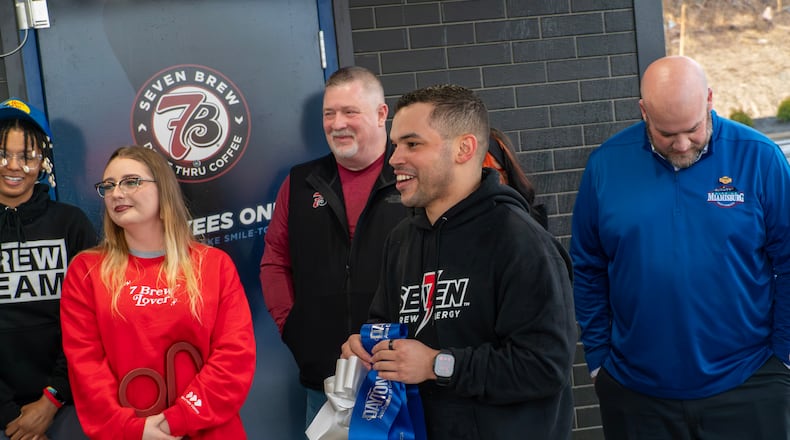 Chace Baxter, 7 Brew Coffee regional manager, welcomes attendees to the ribbon-cutting ceremony held at the new 7 Brew Coffee location at at 310 N. Springboro Pike, which was held March 3 in collaboration with the Dayton Chamber of Commerce. CONTRIBUTED