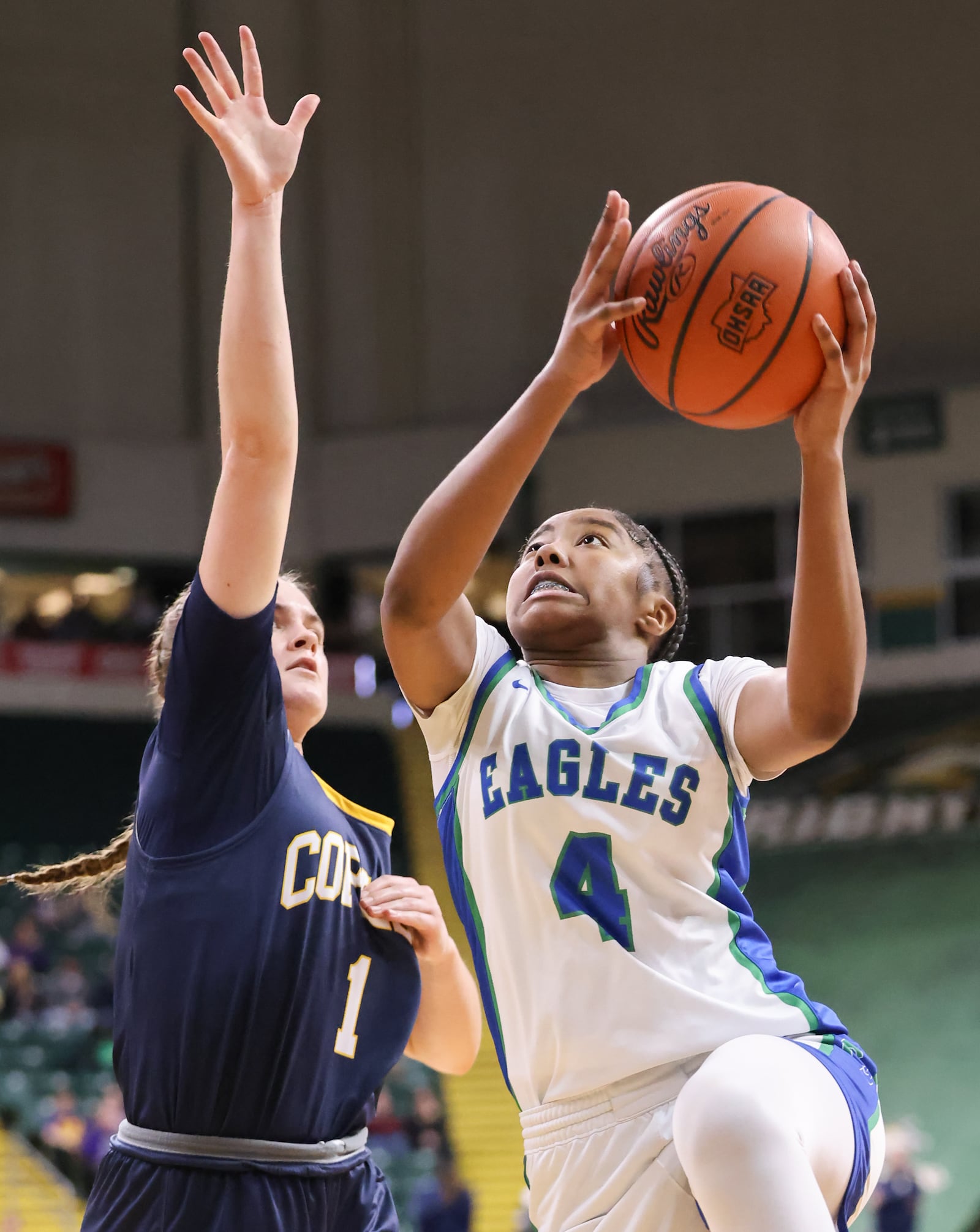 Chaminade-Julienne freshman guard Mychael Hanson shoots with pressure from Copley's Evelyn McKnight during a Division III state semifinal on Thursday, March 12 at Ervin J. Nutter Center in Fairborn. Hanson scored 15 points, 11 of which came in the fourth quarter. BRYANT BILLING / STAFF