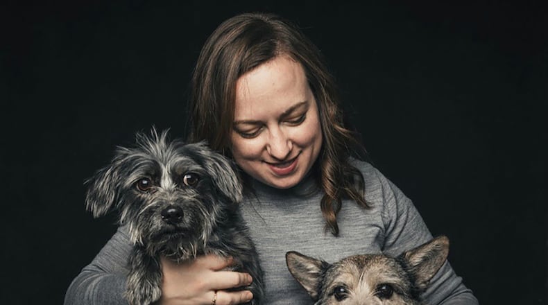 Melanie Wagner with her adopted rescue dogs Waffles (L) and Julep. Wagner is now fostering her 32nd dog and says it's rewarding to send all of them off to their forever homes.
