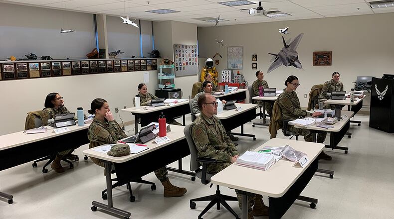 Students receiving training during the Aerospace Physiology Apprentice Course at the United States Air Force School of Aerospace Medicine maintain appropriate social distancing requirements April 1. The Centers for Disease Control and Prevention recommend people ensure they maintain at least 6 feet distance between themselves and others to avoid getting sick by sharing the COVID-19 virus. (U.S. Air Force photo/Capt. Matthew Smith)