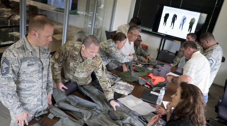 Aircrew Flight Equipment Airmen from the 154th and 15th Operations Support Squadrons examine the latest installments of equipment July 8, 2019 at Joint Base Pearl Harbor-Hickam, Hawaii. Program managers from Write-Patterson Air Force Base, Ohio, introduced the integrated aircrew ensemble to the Airmen, which offers a spectrum of improvements over the currently used equipment. F-22 Raptor pilots from JBPH-H have been selected to be the first aviators to bring the ensemble into an operational capacity. (U.S. Air National Guard photo by Senior Airman John Linzmeier)