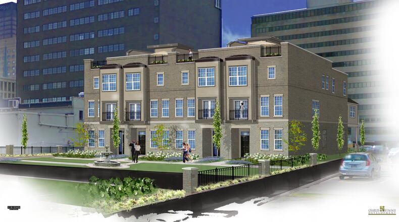 A rendering of the last four townhomes in the Monument Walk community. The development will have green space and an outdoor fountain. SUBMITTED