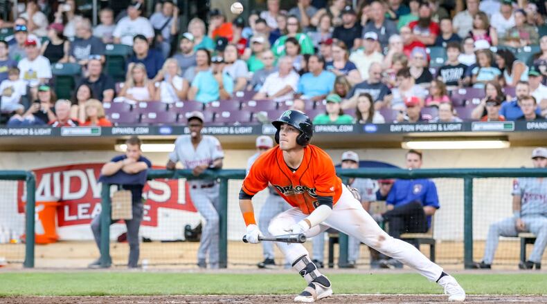 Dayton Dragons center fielder Michael Siani watches his bunt attempt fly into the air during a game against the Wisconsin Timber Rattlers in 2019. CONTRIBUTED PHOTO BY MICHAEL COOPER