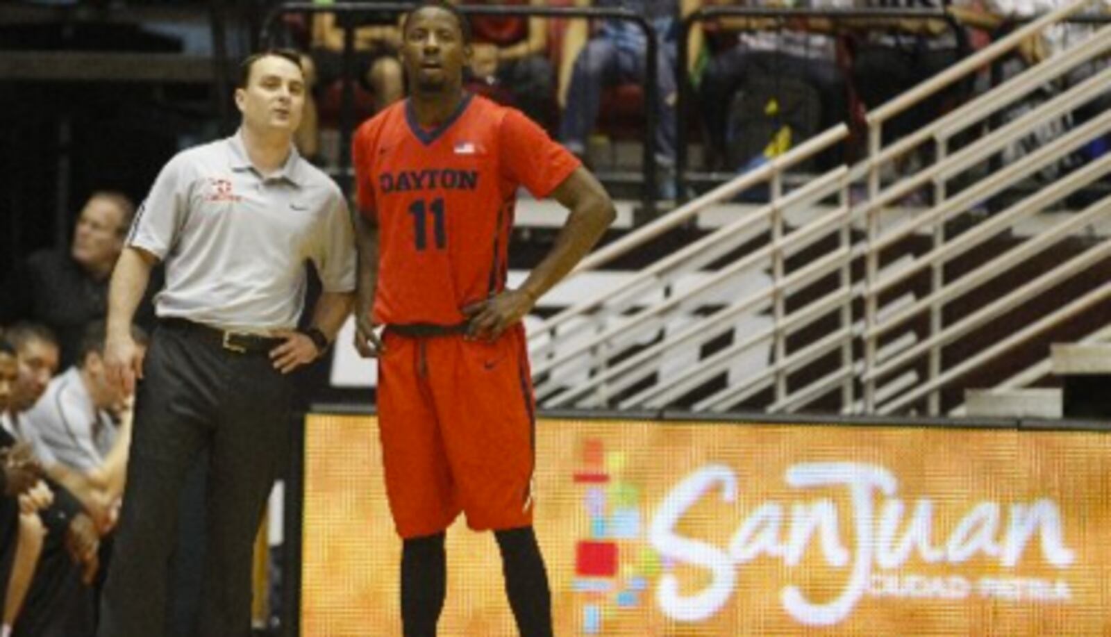 Dayton coach Archie Miller and guard Scoochie Smith talk during a game against Boston College at the Puerto Rico Tip-Off on Sunday, Nov. 23, 2014, in San Juan, P.R. David Jablonski/Staff