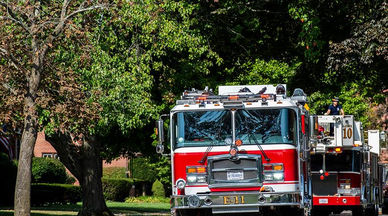 The 788th Civil Engineer Squadron Fire Department holds a parade through military housing Oct. 2 to kick off Fire Prevention Week at Wright-Patterson Air Force Base. U.S. AIR FORCE PHOTO/WESLEY FARNSWORTH