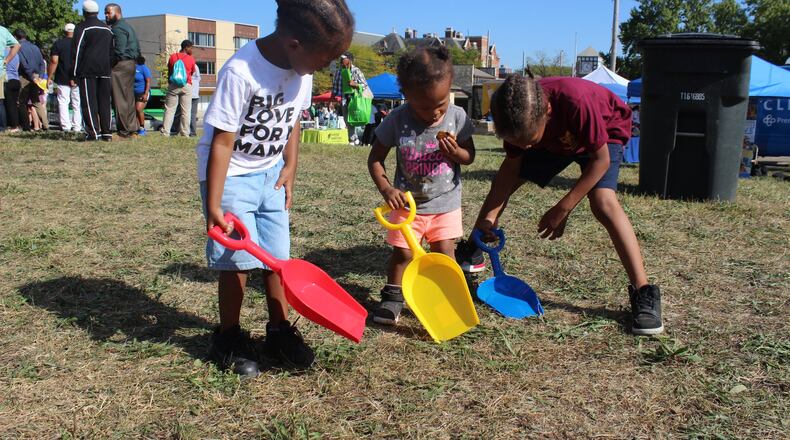 From left to right: Amar, Kourtney and Na’eem Allen help break ground at the Gem City Market. STAFF/BONNIE MEIBERS