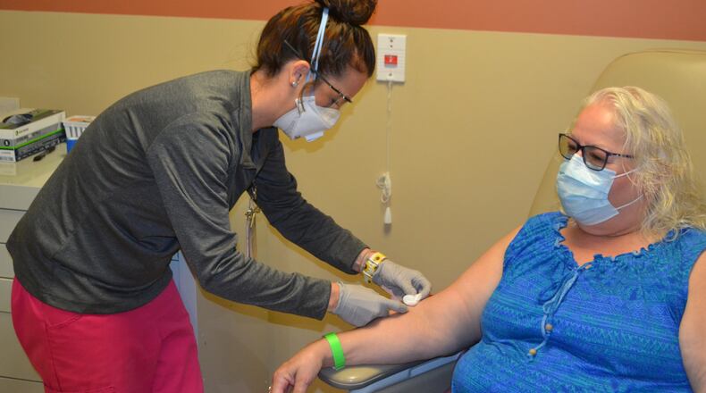Darcy Buckingham, left, prepares Linda Swick for an antibody test. Photo courtesy Wayne HealthCare