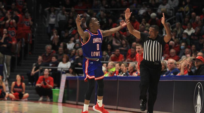 UMass Lowell's Justin Faison celebrates after making a 3-pointer against Dayton on Saturday, Nov. 13, 2021, at UD Arena. David Jablonski/Staff