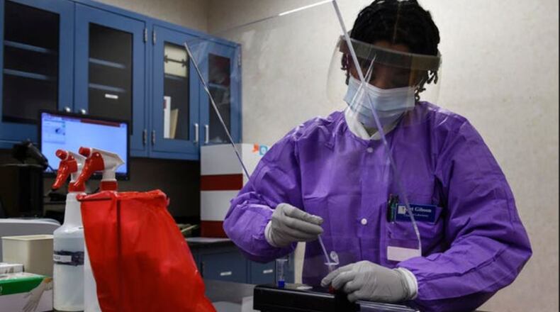 Tech Sgt. Jonisha Gibson, 82nd Medical Group clinical laboratory NCO in charge, prepares a sample for diagnostic testing at Sheppard Air Force Base, Texas. During the last 16 months, the Department of the Air Force Acquisition COVID-19 Task Force executed nearly $4 billion in Health and Human Services requirements for personal protective equipment manufacturing capability, rapid point-of- care testing technologies, and testing and diagnostics supply chain constraints using innovative rapid contracting tools. U.S. AIR FORCE PHOTO/SENIOR AIRMAN PEDRO TENORIO