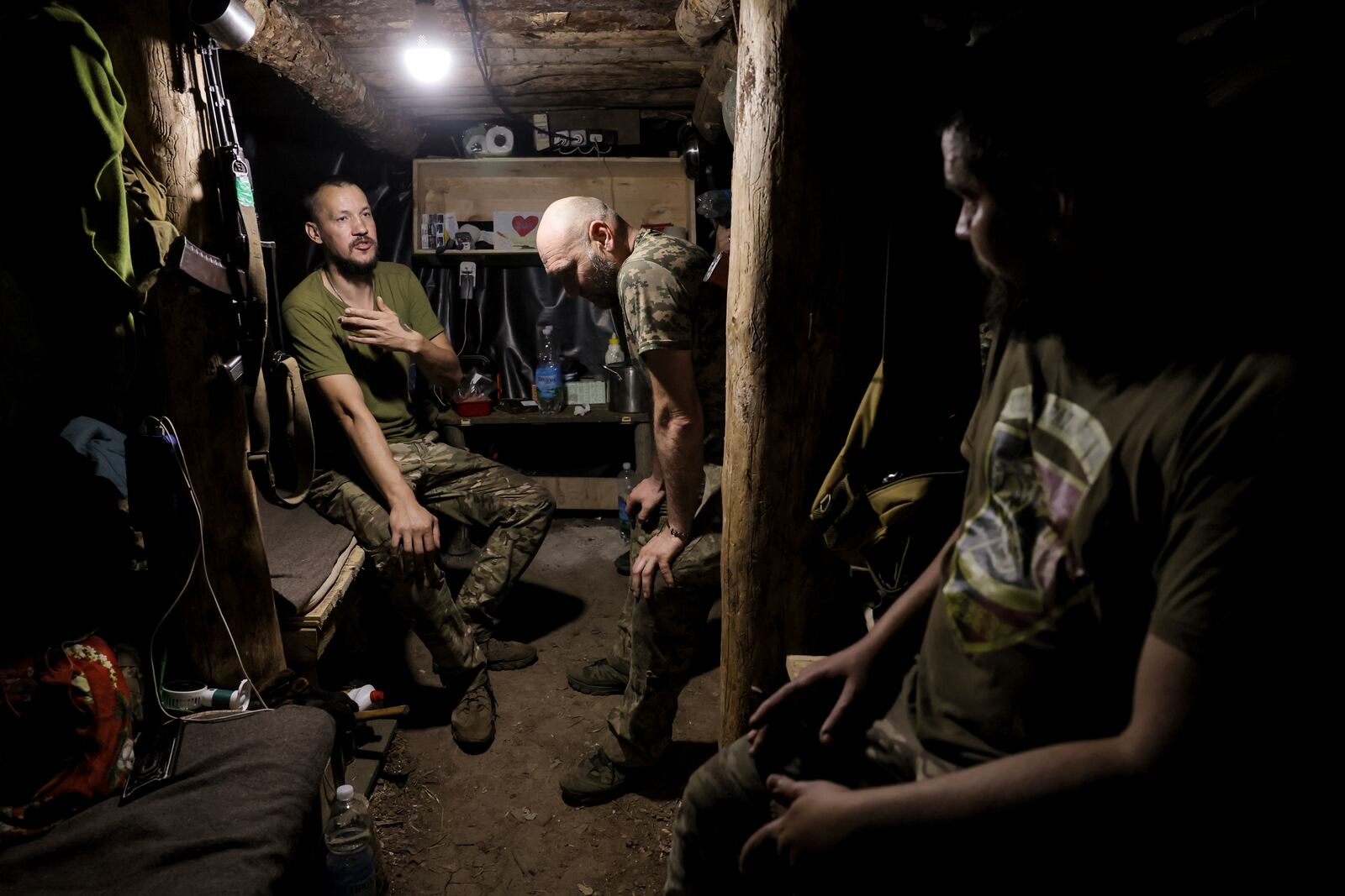 In this photo and provided by Ukraine's 24th Mechanized Brigade press service, soldiers have a rest in a shelter on the frontline near Chasiv Yar, Donetsk region, Ukraine, Tuesday, July 22, 2025. (Oleg Petrasiuk/Ukraine's 24th Mechanized Brigade via AP)