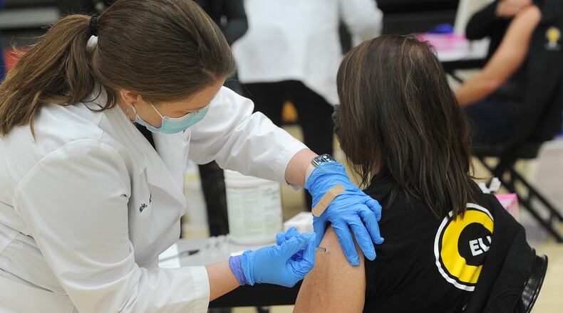 Tammy Drerup, Centerville schools director of student services, receives his first dose of COVID-19 vaccine at Centerville High School, Wednesday, Feb. 3, 2021.