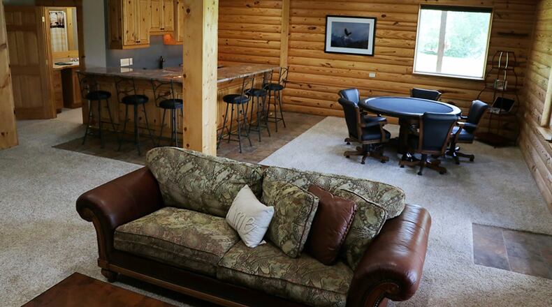 Under 9-foot ceilings the finished lower level has versatility to be used either as a recreation space or as additional living quarters for extended family or guests. Its open gathering space is currently used for dining and sitting areas.