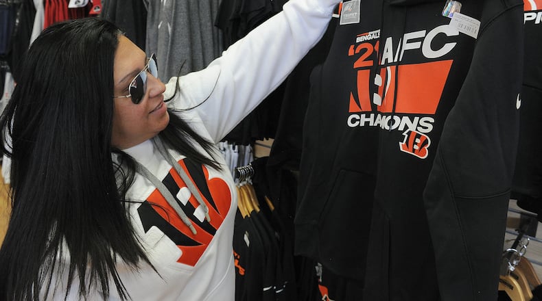 Lisa Zimmerman, checks out Bengals merchandise Wednesday Feb. 9, 2022 at the Rally House located at 2782 Miamisburg Centerville Road. Bengals fans have been flocking to the store looking for Bengals gear. MARSHALL GORBY\STAFF