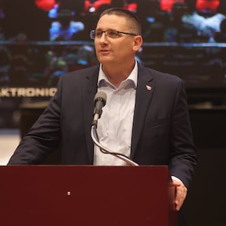 Dayton Athletic Director Neil Sullivan speaks at The Spotlight Town Hall, a mental health event, on Wednesday, Oct. 9, 2024, at UD Arena in Dayton. David Jablonski/Staff