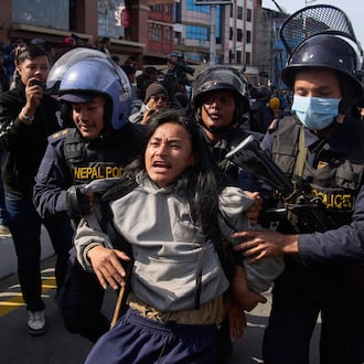 Nepalese police detain a young protester during an anti-government rally in Kathmandu, Nepal, on Dec. 22, 2025. (AP Photo/Niranjan Shrestha)