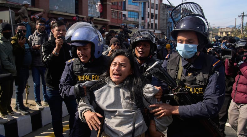 Nepalese police detain a young protester during an anti-government rally in Kathmandu, Nepal, on Dec. 22, 2025. (AP Photo/Niranjan Shrestha)
