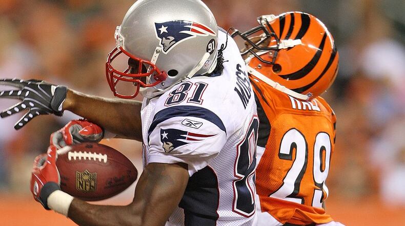 CINCINNATI - OCTOBER 01: Randy Moss #81 of the New England Patriots catches a touchdown pass while defended by Leon Hall #29 of the Cincinnati Bengals during the NFL game on October 1, 2007 at Paul Brown Stadium in Cincinnati, Ohio. (Photo by Andy Lyons/Getty Images)